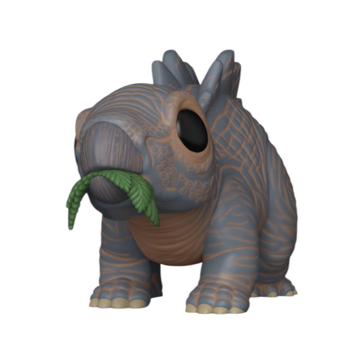 Toy figure of a dinosaur-like creature with a leaf on a white background