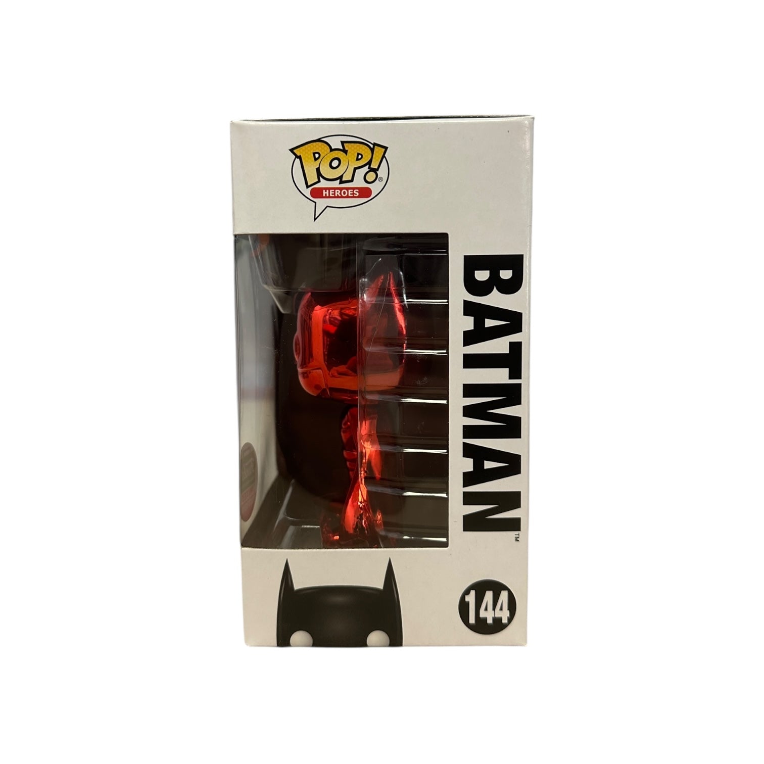 Pop! Heroes Batman figure packaging with red figure inside