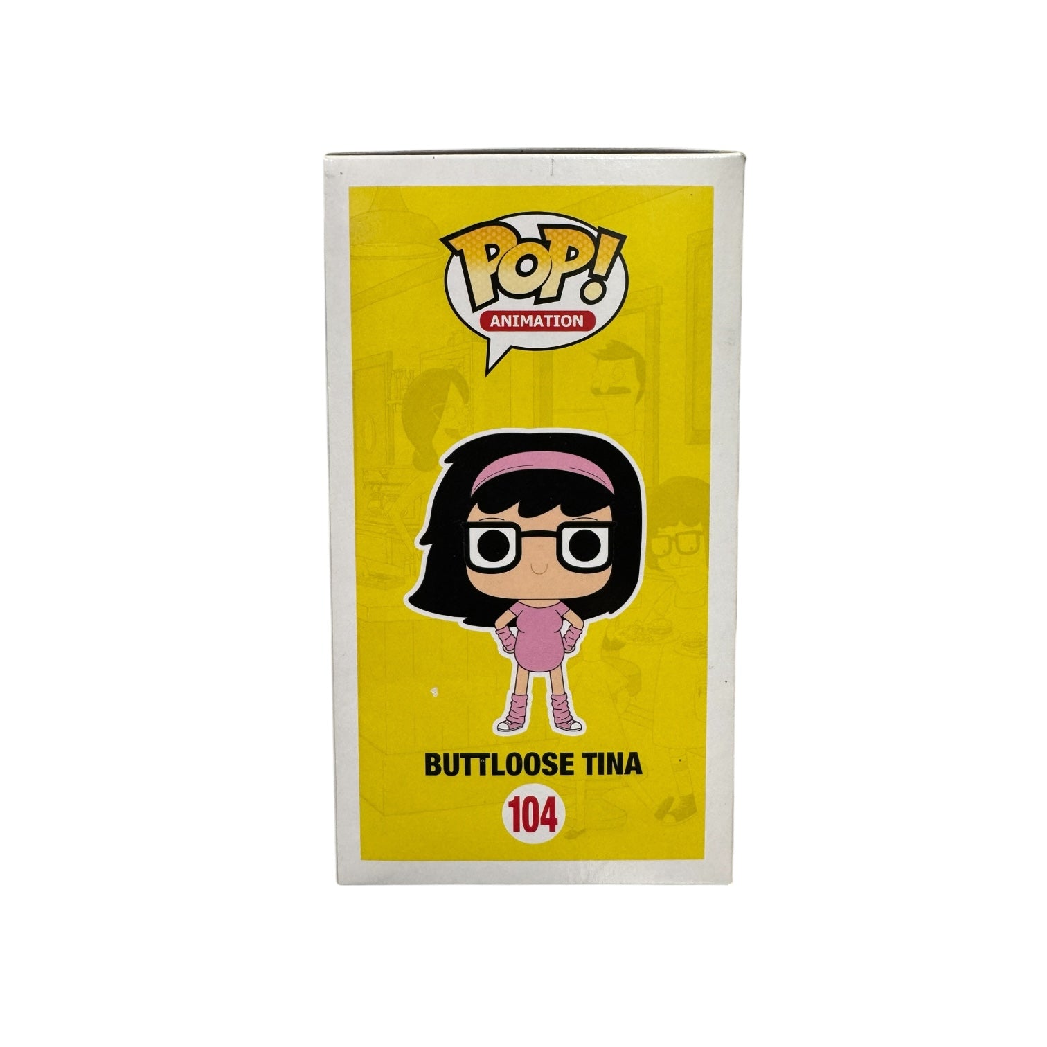 Tina Belcher dressed in pink work out attire and a pink sweatband. Black framed glasses with hands on her hips. Side of box.