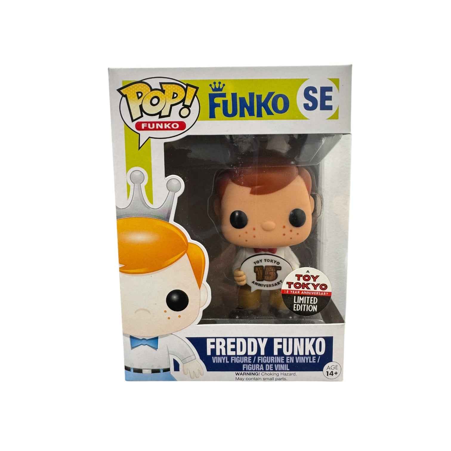 Freddy Funko holding a sign saying "Toy Tokyo 15th Anniversary"