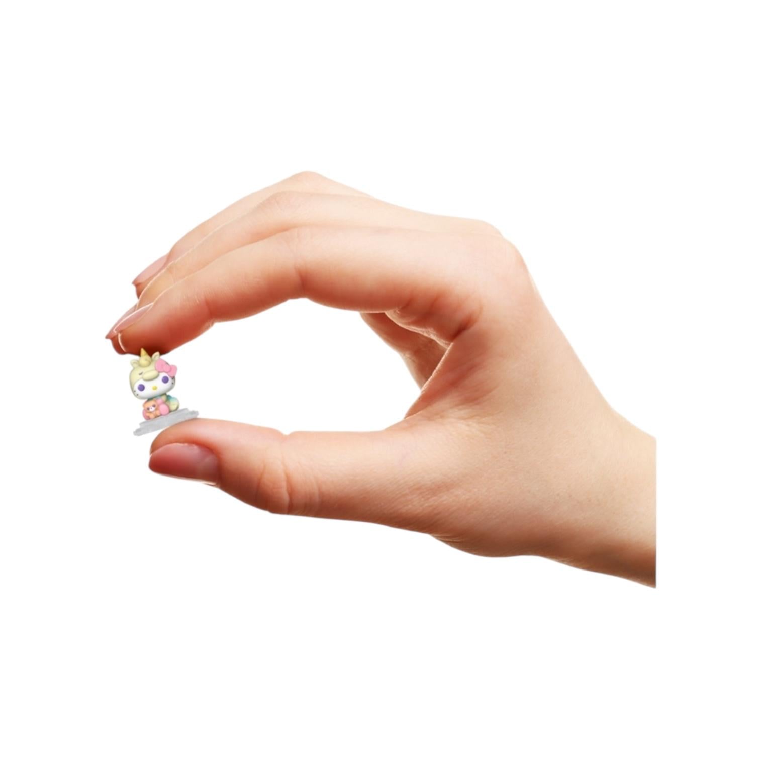 Hello Kitty between Finger tips on a white background