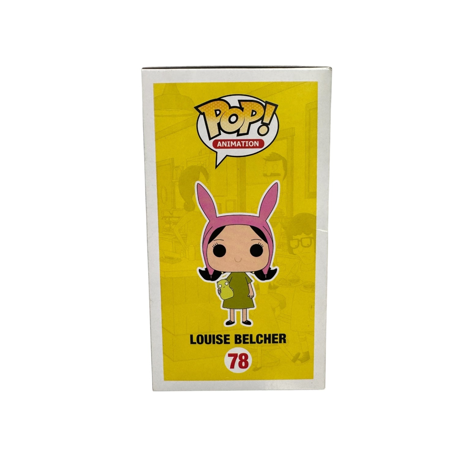 Louise Belcher | Funko Pop | Bob's Burgers . Louise in green dress holding a green teddy wearing pink rabbit ears.