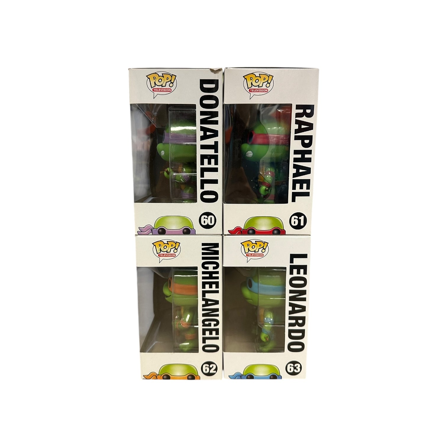Boxed set of Funko Pop! Teenage Mutant Ninja Turtles figures with clear panels showing the figures inside.