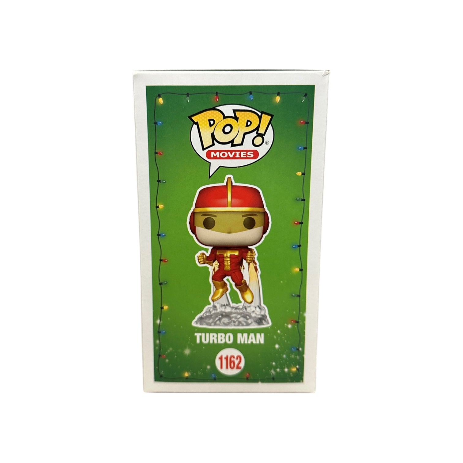 Funko Pop! Turbo Man figure in packaging with green background and colorful lights.