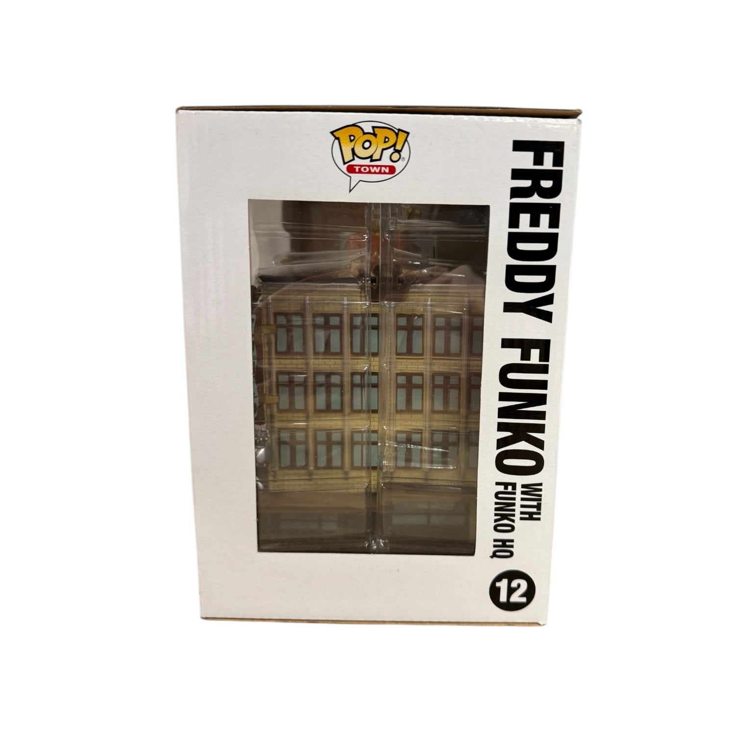 Freddy Funko with shopping bags standing next to Funko HQ building