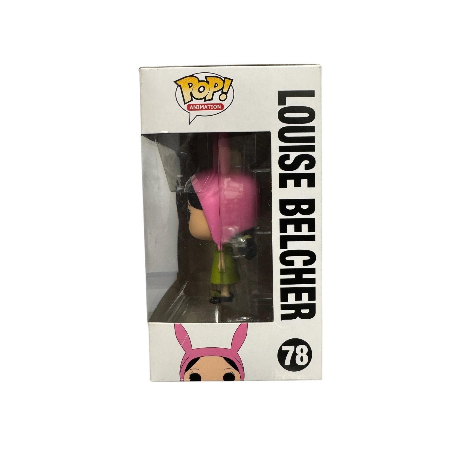 Louise Belcher | Funko Pop | Bob's Burgers . Louise in green dress holding a green teddy wearing pink rabbit ears. 