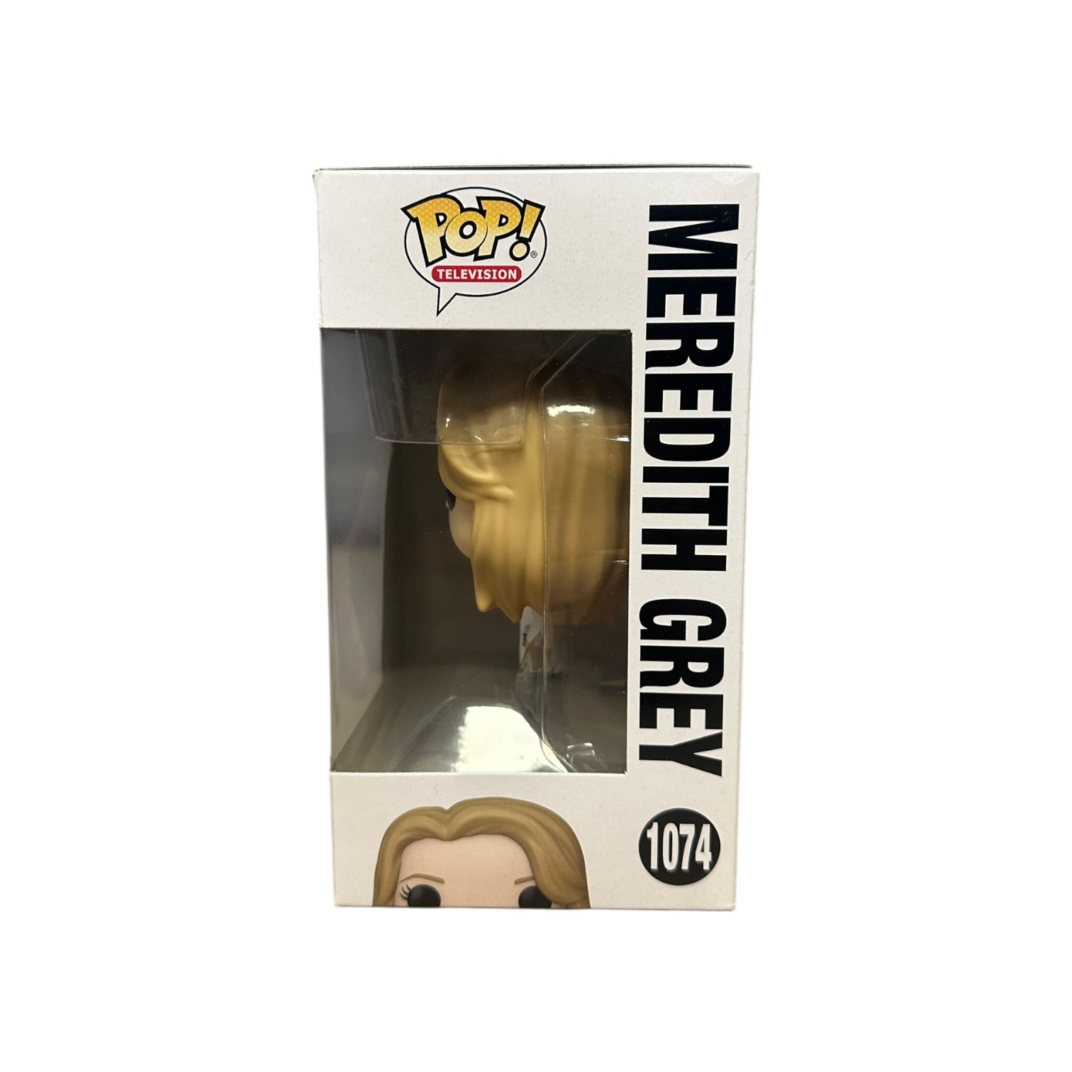 Funko Pop! box with gold head figure and 'Meredith Grey' text on a white background