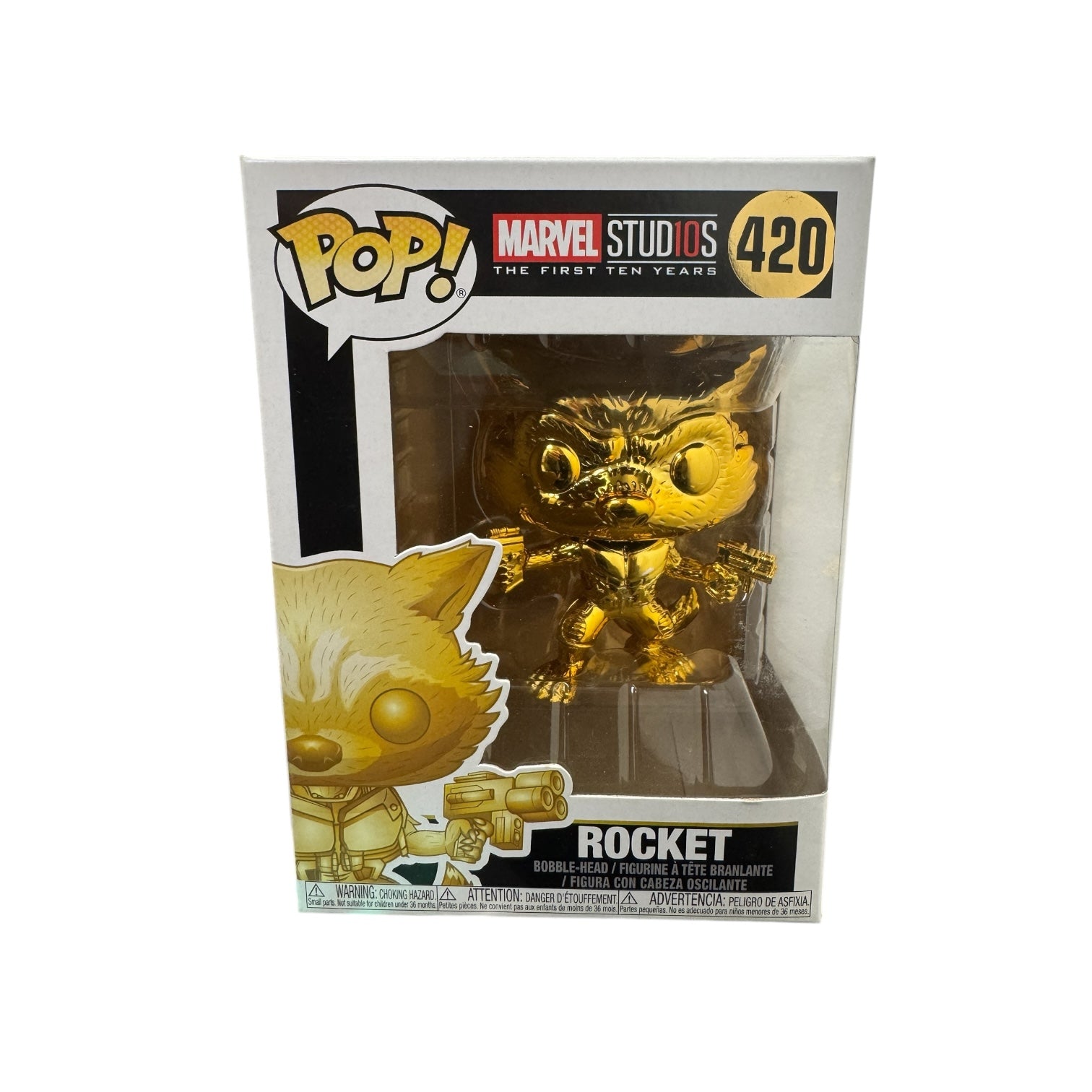 Rocket from Guardians of the Galaxy standing with a gun in each hand. Gold chrome affect. 