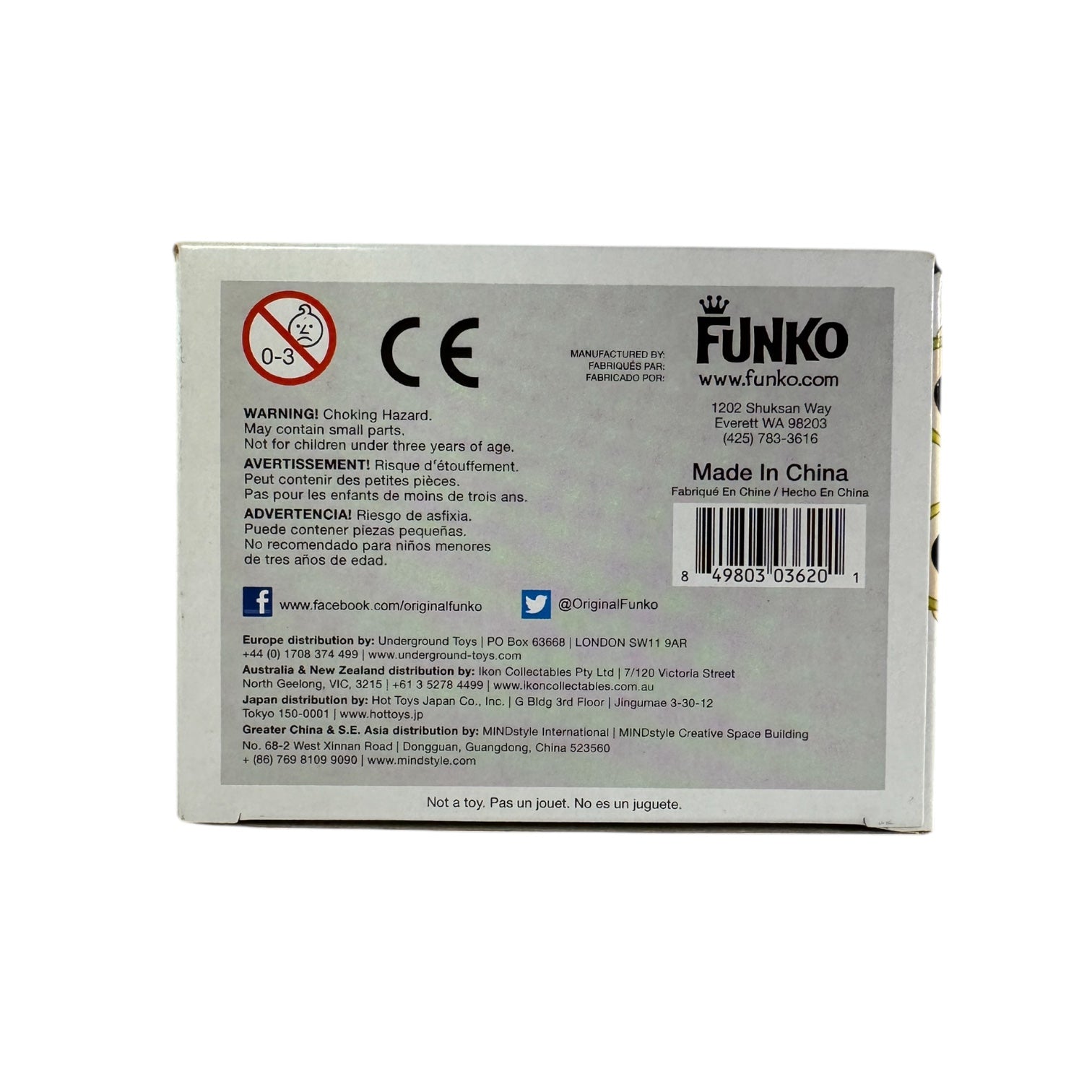 Stan Lee standing with his hands pulling apart a red jumper showing a white t-shirt that says 'Fan Expo' wearing red boots.